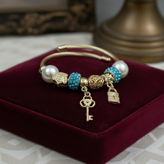 1435-Pretty Precious Gold Twisted Cable Charm Bracelet with Beads, Elephant Charms, Crystal Accents, Adjustable Bangle